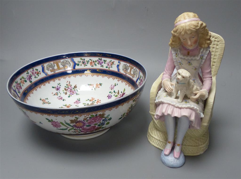 A French coloured biscuit porcelain figure of a seated girl and a Samson armorial bowl, c.1900, diameter 23cm